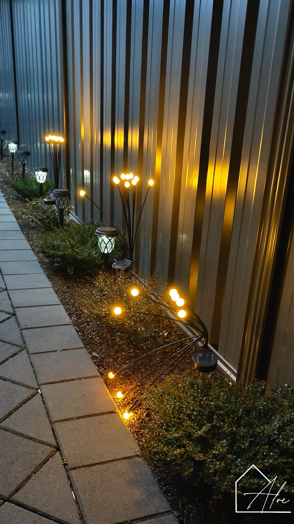 Solar firefly garden lights in garden bed – solar powered LED stakes