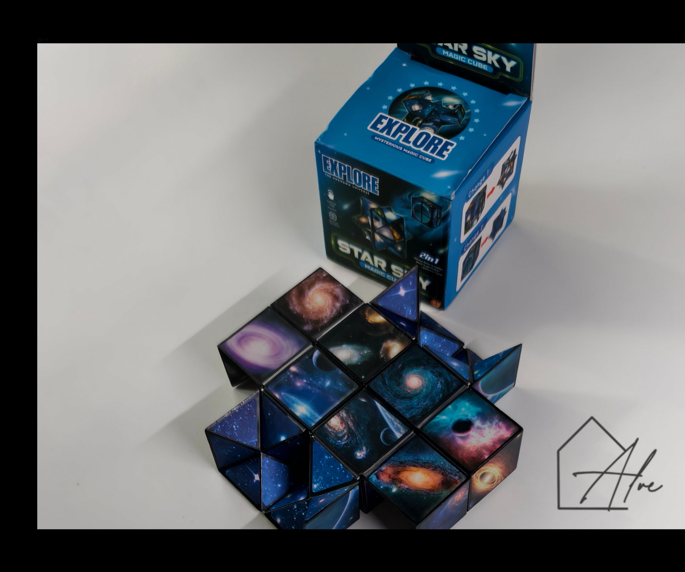 Space puzzle cube mid-transformation with galaxy panels and starfield wings extending from the base