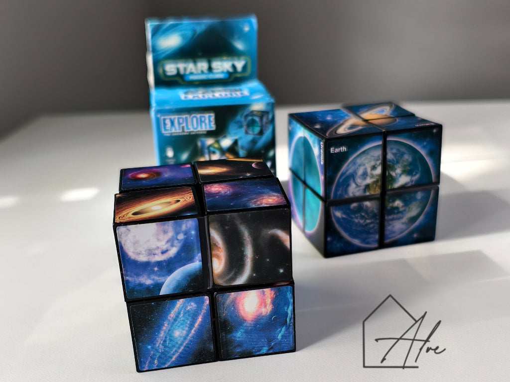 Close-up of two star shapes stacked together showing detailed starfield and galaxy panels