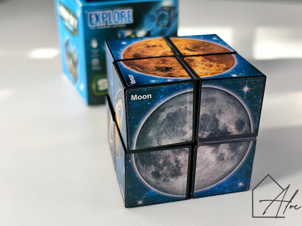 Close-up of cube showing Venus on top and the Moon on the front face, with planet names labelled