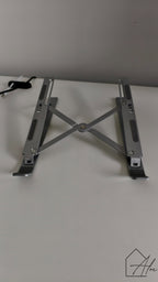 Foldable laptop riser in use – raises screen to ergonomic eye level