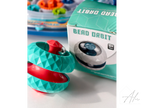 Teal and red sphere fidget ball showing the faceted low-poly surface