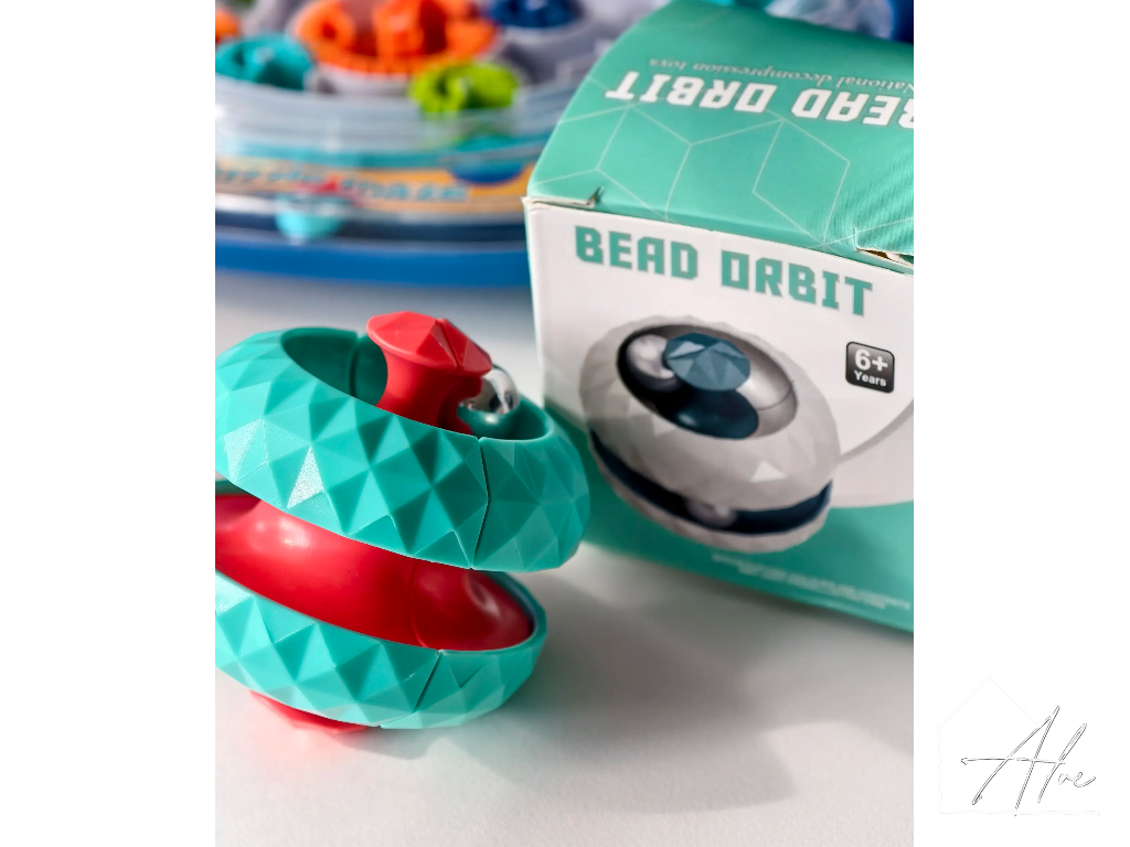 Teal and red sphere fidget ball showing the faceted low-poly surface