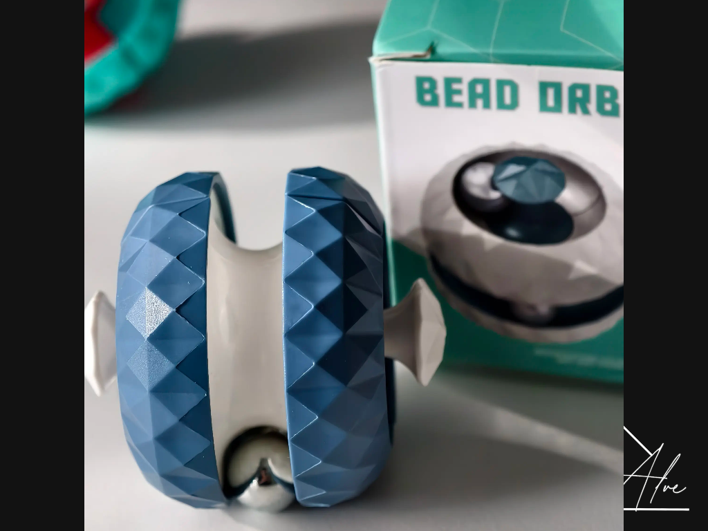 Blue sphere fidget ball with a steel bead visible in the internal channel