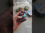 Close-up of the sphere fidget ball's two rotating halves and faceted low-poly surface
