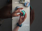 Sphere fidget ball turned through different angles showing the faceted panels and metal beads inside