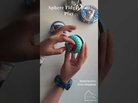 Sphere fidget ball turned through different angles showing the faceted panels and metal beads inside