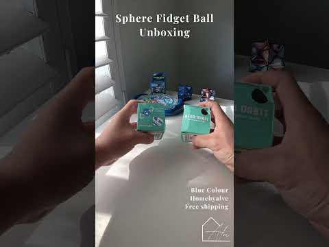 Sphere fidget ball held and squeezed in the palm, showing its use as a decompression ball